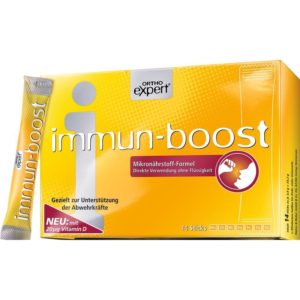 Gelbe Verpackung mit der Aufschrift "immun-boost" und einem Stick an der Seite.